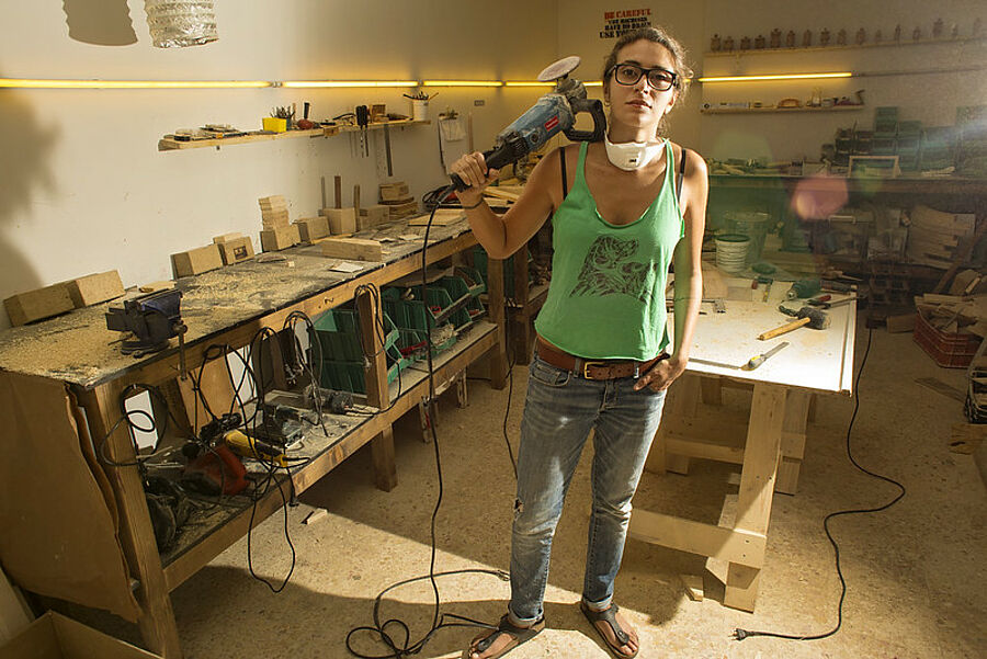 female artisan woodworker in her Studio in Lebanon