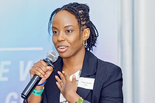 The picture shows Muthoni Karubiu, Chief Operating Officer at Amini Kenya